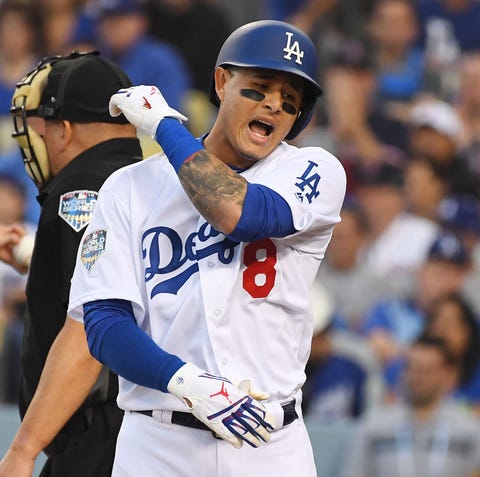 Machado reacts after striking out in Game 5 of...