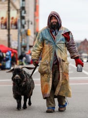 Erick Brown and his deer Deer descend Woodward Avenue before the 92nd anniversary parade of Thanksgiving in Detroit on Thursday, November 22, 2018.