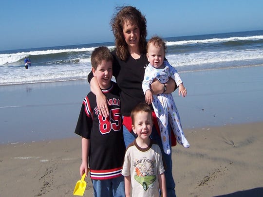 Jason Gleason's wife, Heather, and sons, Brady, Carson and Isaac. Heather died in 2011.