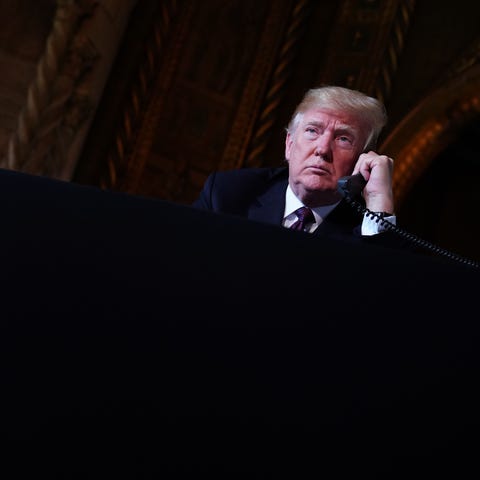 President Donald Trump speaks to members of the...