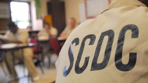 Inmates in a math class at Tyger River...