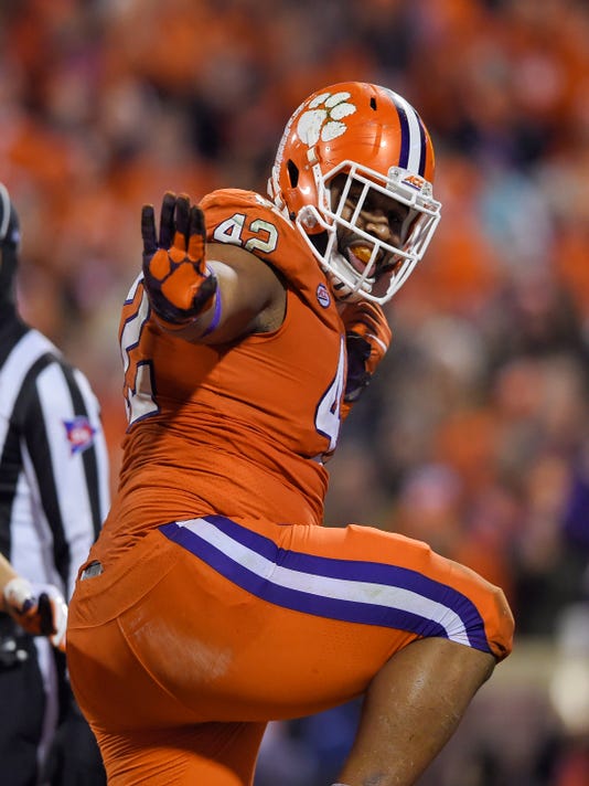 Clemson football's Christian Wilkins strikes the Heisman pose