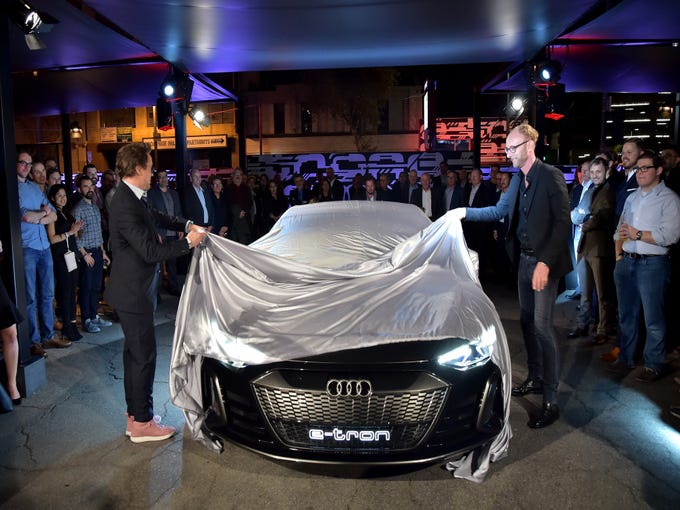 Robert Downey Jr. (L) and Head of Design of Audi AG, Marc Lichte attend the global reveal of the Audi e-tron GT concept in Los Angeles on Monday, November 26th, 2018.