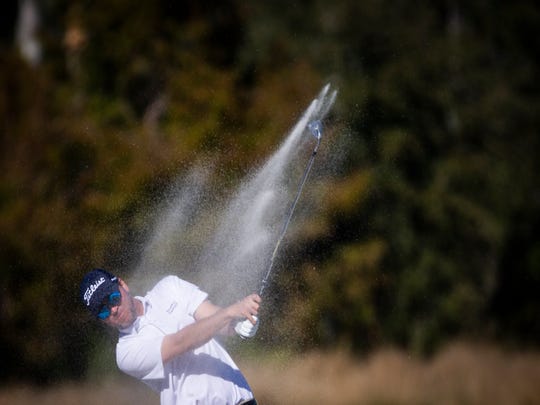 Sean O'Hair chips the ball from the sand during the 30th annual QBE Shootout Pro-Am on Thursday at Tiburón Golf Club.