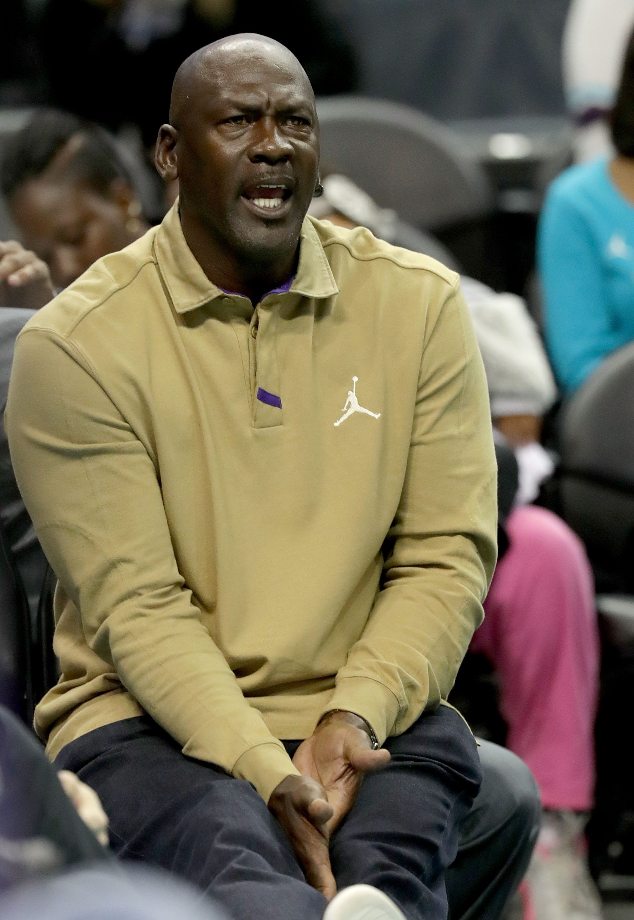 Michael Jordan smacks Hornets' Malik 