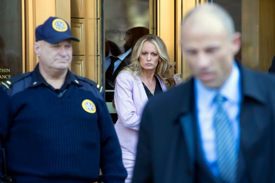 April 16, 2018: Adult film actress Stormy Daniels, center, follows her attorney Michael Avenatti, right, as she leaves federal court in New York.  A U.S. judge listened to more arguments about President Donald Trump's extraordinary request that he be allowed to review records seized from his lawyer, Michael Cohen, office as part of a criminal investigation before they are examined by prosecutors. The raid at Cohen's apartment, hotel room, office and safety deposit box sought bank records, records on Cohen's dealing in the taxi industry, Cohen's communications with the Trump campaign and information on payments made in 2016 to former Playboy model Karen McDougal and to Daniels.