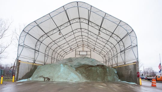 Road salt is piled up an Ingham County Road Commission storage facility at Aurelius Road in Lansing  on Thursday, Dec. 20, 2018.