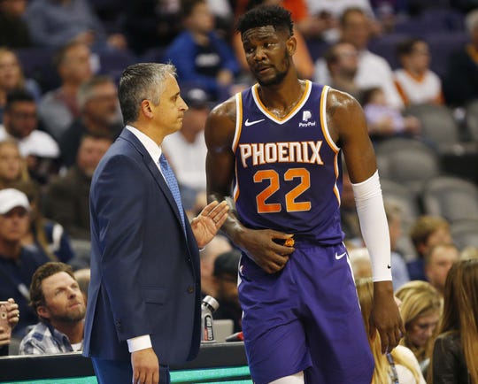 Phoenix Suns head coach Igor Kokoskov talks with Phoenix Suns center Deandre Ayton (22) during the first quarter against the Charlotte Hornets in Phoenix January 6, 2019.