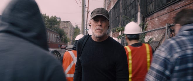 David Dunn (Bruce Willis) protects the streets of Philadelphia in "Glass."
