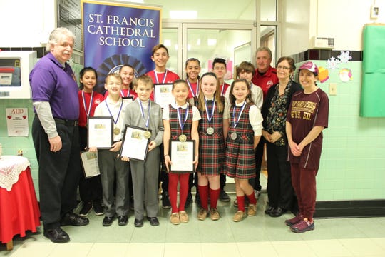 Congratulations to St. Francis Cathedral students who won the annual Metuchen Elks Soccer Shoot Out contest. Pictured from left to right in the front row are: Mike Walsh, Metuchen Elks #1914, Aidan Quinn, Jimmy Cassalia, Ashley Bojar, Emily Miller, Fiorella Perone, Principal Ann Major, Physical Education Teacher Carolyn Roberts. In the back row from left to right is: Angelina Lozano, Francesca Corea, Alejandro Ruiz, Angelina Vargas, Raymond Perone, John Risley, Nick Dorschenko, Metuchen Elks #1914. Not pictured is Christian Johnson.