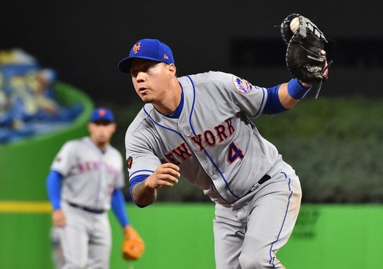 Apr 10, 2018: New York Mets first baseman Wilmer Flores (4) fields the ball before making an out in the third inning against the Miami Marlins at Marlins Park.