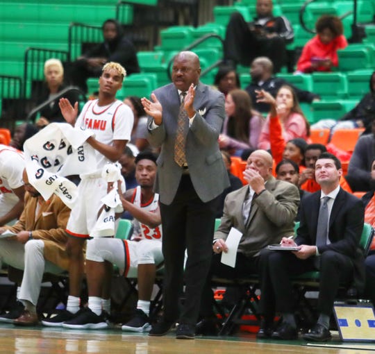 FAMU men's basketball coach Robert McCullum cheers on the team at the Al Lawson Multipurpose Center.