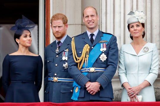 Duchess Meghan of Sussex, Prince Harry, Prince William and Duchess Kate of Cambridge mark the centenary of the Royal Air Force from the balcony of Buckingham Palace on July 10, 2018.