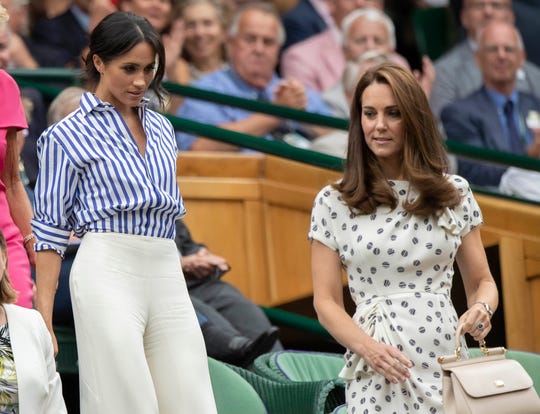 Duchess Meghan of Sussex and Duchess Kate of Cambridge at Wimbledon on July 14, 2018