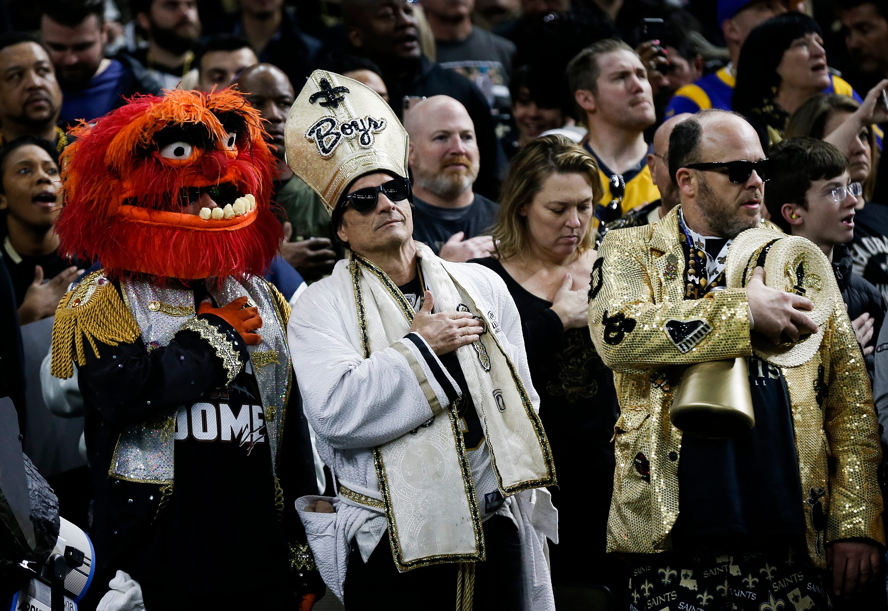 Saints fans line streets in New Orleans in protest as the Los Angeles Rams ...