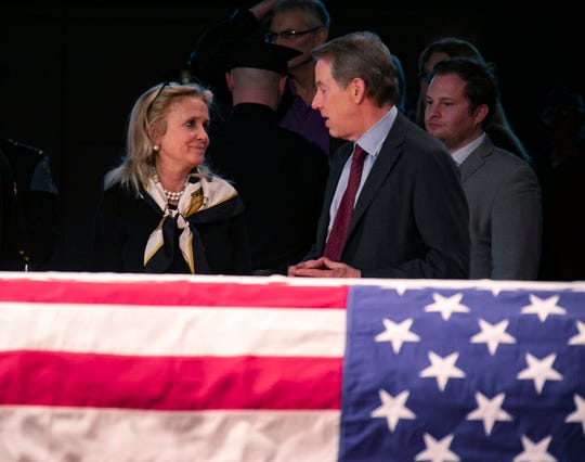 Congresswoman Debbie Dingell greets Bill Ford Jr. as visitors stream by to pay their respects to her husband, John Dingell, during visitation at the Michael A. Guido theater in Dearborn Monday, Feb. 11, 2019. 