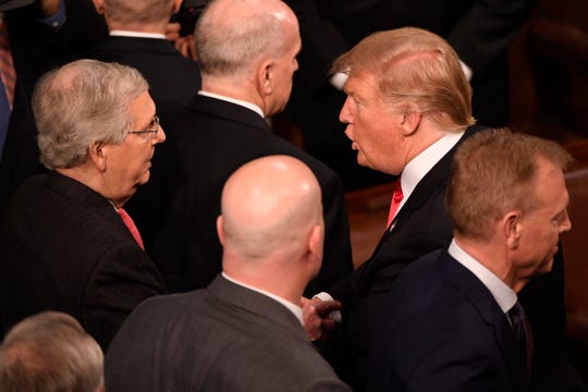 President Donald Trump greets Sen. Mitch McConnell, R-Ky., after he delivered the State of the Union address Feb. 5, 2019.