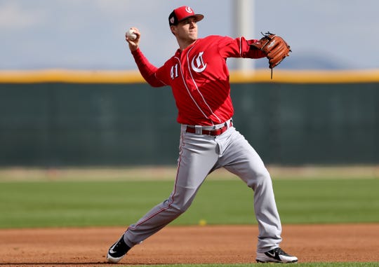 Cincinnati Reds pitcher Matt Wisler (41) throws to first base during fielding drills, Sunday, Feb. 17, 2019, at the Cincinnati Reds spring training facility in Goodyear, Arizona.