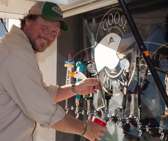Bo Walker, co-owner of Oyster City Brewing Company, pours a beer during the inaugural Big Bend BrewFest last year in Perry. Oyster City will be one of the nearly 20 breweries featured there for the 2nd Annual event, which will be held March 2 at Rosehead Park.