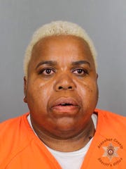 This undated booking photo provided by the Arapahoe County Sheriff's Office shows Tina Black. Black and his son, Terance Black, were sentenced to life without parole for the murder of a witness who cooperated with the police to investigate the robbery in 2016 of a marijuana store in Colorado. The secret murder case became public on Thursday, February 21, 2018 when Terance Black and Tina Black were sentenced to the Arapahoe County Court.