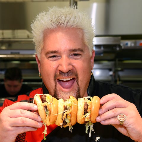 Chef and television personality Guy Fieri holds ha