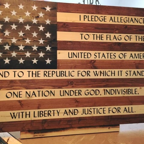 Pledge of Allegiance on American spruce flag.