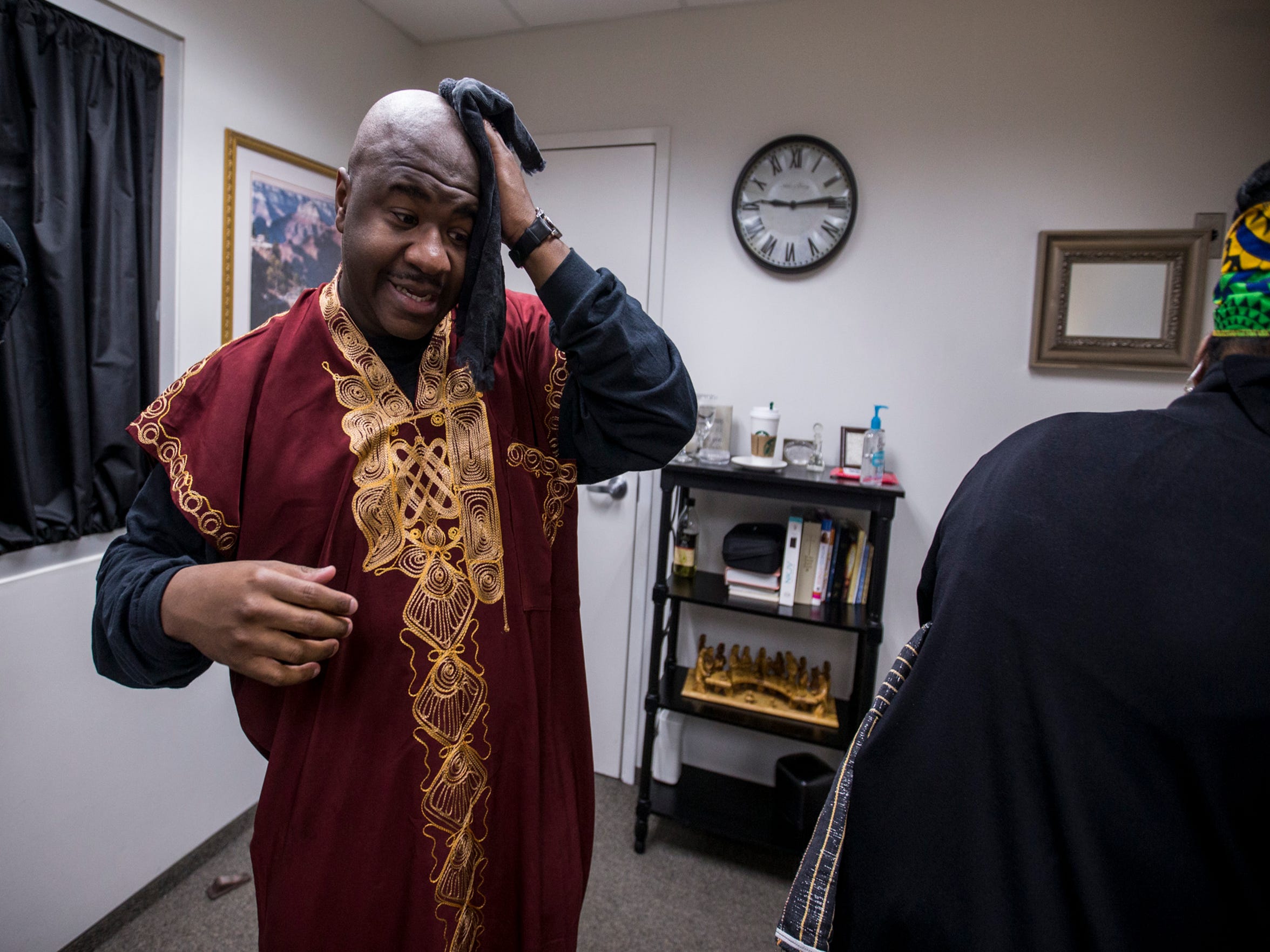 Pastor Terry Mackey wipes his head in the vestry after the 7:30 a.m. service on Feb. 24, 2019, at Pilgrim Rest Baptist Church in Phoenix. Mackey was appointed to replace the late Bishop Alexis Thomas.