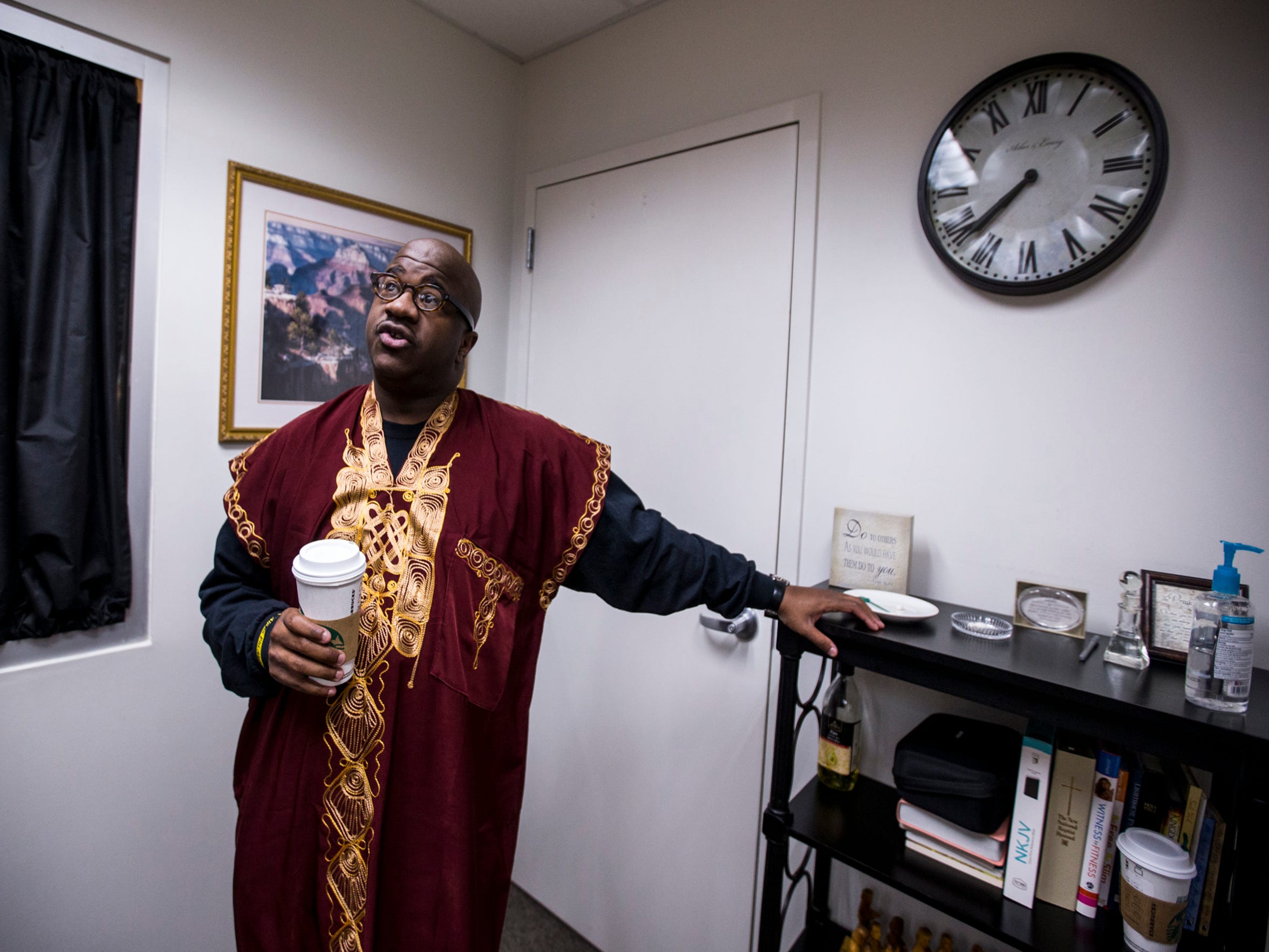 Starbucks in hand, Pastor Terry Mackey prepares for the 7:30 a.m. service at Pilgrim Rest Baptist Church in Phoenix.