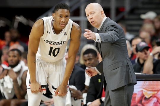 Cincinnati Bearcats head coach Mick Cronin talks with Cincinnati Bearcats guard Rashawn Fredericks (10) in the first half of an NCAA college basketball game against the Memphis Tigers, Saturday, March 2, 2019, at Fifth Third Arena in Cincinnati. 