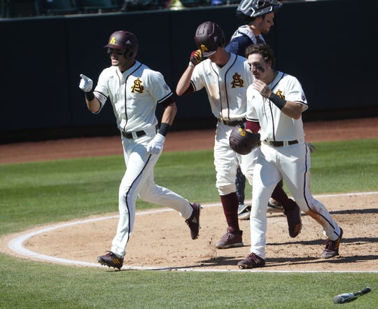 ASU's Hunter Bishop (4) celebrates with Erik Tolman (15) and Trevor Hauver (18) after hitting a three run home run during the third inning of a game against Xavier at Phoenix Municipal Stadium in Phoenix, Ariz. on March 10, 2019.