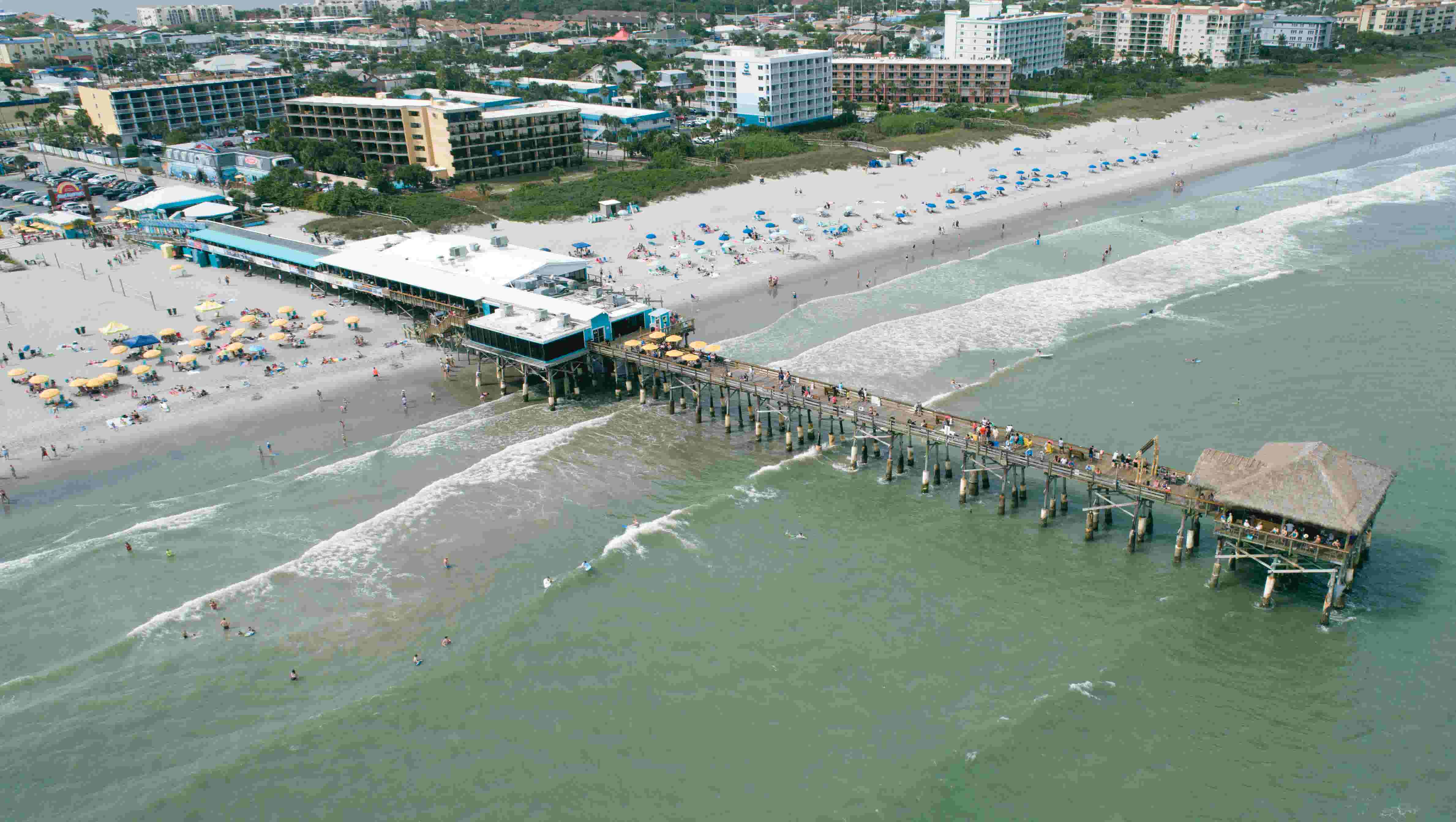 Drone video Surfers at Cocoa Beach Pier, great place to watch rocket