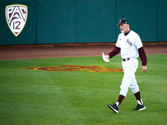 ASU head baseball coach Tracy Smith walks back to the dugout before a baseball game against New Mexico at Phoenix Municipal Stadium on March 13, 2019. 