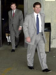 Michael DiLeonardo, right, accused of belonging to the Gambino crime family, on the right, followed by his lawyer, Craig Gillen, left, leaving the federal building in Atlanta, Wednesday, August 1, 2001. Without any explanation from defense lawyers and prosecutors. , the testimony in the Gold Club trial was abruptly annulled on Wednesday and the proceedings were suspended. (AP Photo / Gregory Smith)