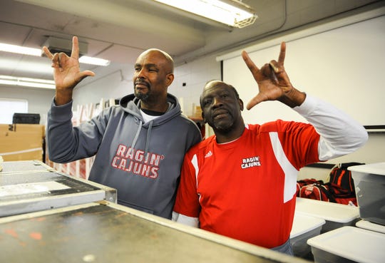 Lloyd Darby, left, and the late Leonard Wiltz, right, have devoted years of serve to the UL athletic program. Wiltz will be laid to rest Saturday.