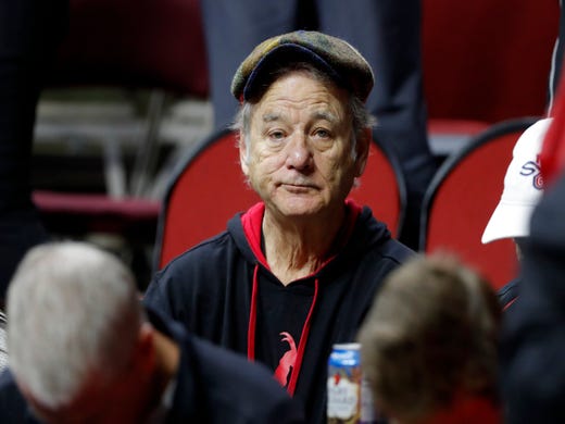 First round: Actor Bill Murray sits in the stands before the game between Minnesota and Louisville.