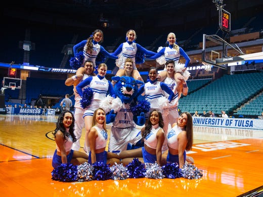 First round: The Georgia State Panthers cheerleaders and mascot pose for a group photo on the court.