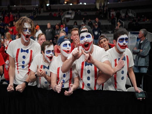 First round: Liberty Flames fans cheer during the game against the Mississippi State Bulldogs.