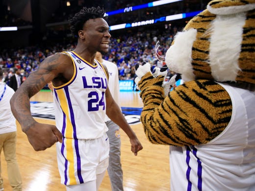 Round of 32: LSU forward Emmitt Williams celebrates the win over Maryland with the Tigers mascot.