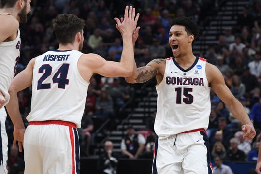 Gonzaga Bulldogs forward Brandon Clarke (15) reacts with forward Corey Kispert (24) during the first half in the second round of the 2019 NCAA Tournament against the Baylor Bears at Vivint Smart Home Arena.