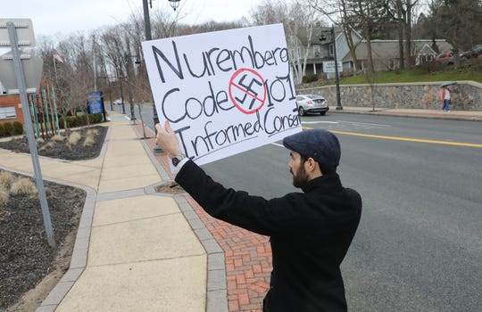 Kevin Connery from Brooklyn holds a protest outside the Rockland County Office Building in New York City in Protest of the State of Emergency on Friday, March 29, 2019.