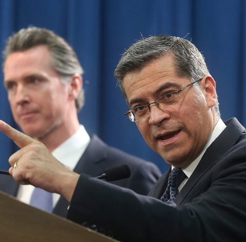 California Attorney General Xavier Becerra, right,