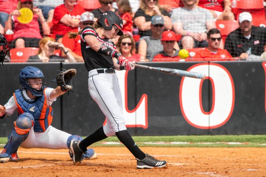 UL's Sarah Hudek connects with the pitch as the Ragin' Cajuns take on the University of Texas Arlington Mavericks in a double-header at Yvette Girouard Field on Saturday, April 6, 2019.