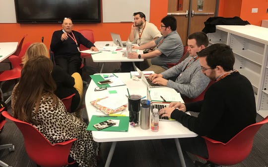 Harvey Silver, back left, of The Thoughtful Classroom leads a discussion with Linden High School teachers to go over a lesson delivered by teachers Jorge Alvarez and Anthony Fischetti, back right, in the LHS Learning Commons.