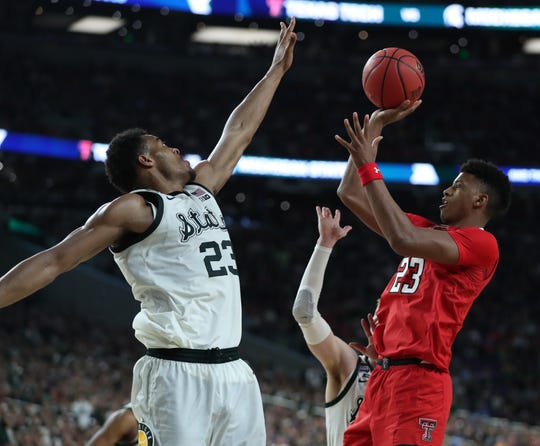 Michigan State forward Xavier Tillman is guarding Texas Tech Jarrett Culver in the second half of the quarterfinal match at US Bank Stadium in Minneapolis, Minnesota, on Saturday, April 6, 2019.