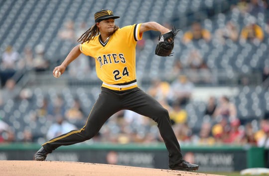 Pittsburgh Pirates starting pitcher Chris Archer (24) delivers a pitch against the Cincinnati Reds during the first inning at PNC Park on April 7.