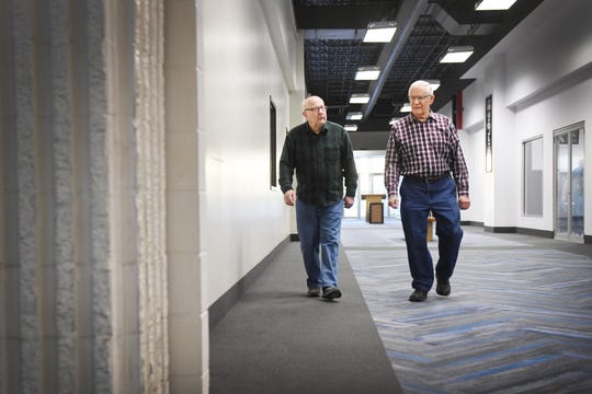 Bill Winness, left, and Ray Smidt, right, walk the Western Mall together Tuesday, April 9, in Sioux Falls. Winness and Smidt's friend Keith Clark, 81, had a heart attack last week during their morning walk. The three of them usually walk the mall together. They have been doing their morning routine without Keith until he gets better.