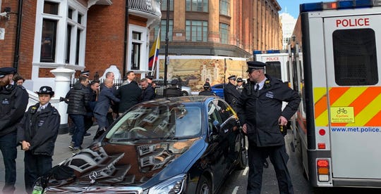 Police carry WikiLeaks founder Julian Assange from the Ecuadorian embassy in London after he was arrested by officers from the Metropolitan Police and taken into custody on April 11, 2019.