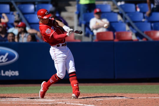 Cincinnati Reds relief pitcher Michael Lorenzen (21) hits an RBI double during the fifth inning against the St. Louis Cardinals at Estadio de Beisbol Monterrey.