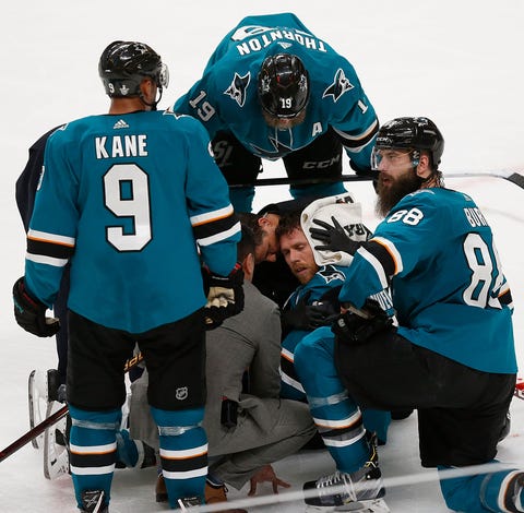 Sharks captain Joe Pavelski receives treatment on...