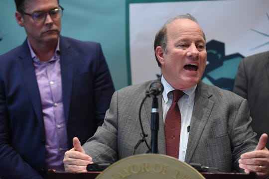 Detroit Mayor Mike Duggan announced the signing of an agreement to build a 5,000-job assembly plant in Detroit with Mark Stewart (left), CFO's Chief Operating Officer. Land Acquisition Agreements were entered into with Fiat Chrysler Automobiles on Friday, May 3, 2019.